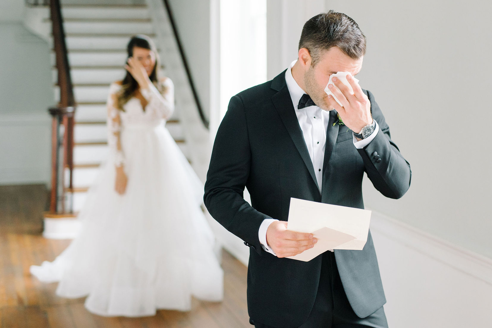 emotional groom at the first look