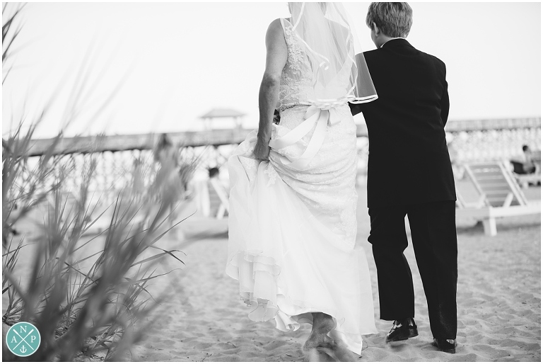Son walking mom down the aisle at her wedding, Folly Beach Wedding, folly beach elopement, folly pier, Photo by Aaron Nicholas Photography, destination wedding photographer based in Charleston, South Carolina