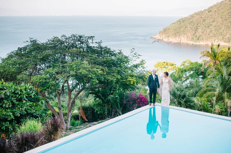 Bride and groom standing on a pool, mountain top wedding, dramatic wedding portraits, Destination wedding in Mexica at Verana small luxury spa and resort - Photos by Aaron and Jillian Photography -_0002