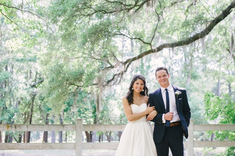 Bride and Groom under a live oak with spanish moss, Caitlin + Sam's Palmetto Landing Wedding in Charleston, South Carolina - Photo by Aaron and Jillian Photography 