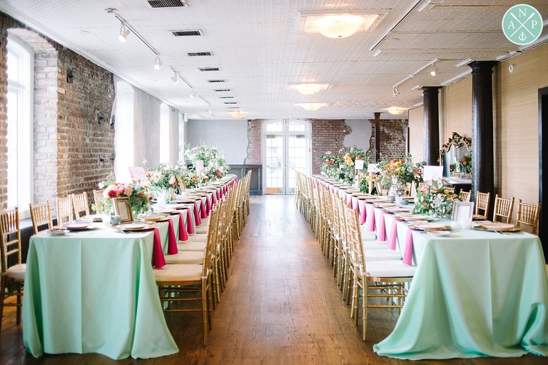 Tate and Davis's Historic Rice Mill Wedding by Charleston wedding photographers Aaron and Jillian Photography - Charleston Stems, reception decor, Southern wedding reception, gold chiavari chairs, mint linens, pink, yellow, white florals, gold chargers, dodeline designs, Southern Protocol